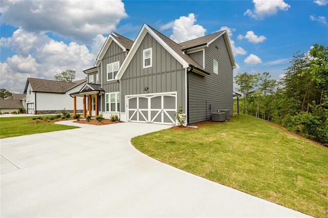 8245 Dawson View Way, Cumming, GA 30028 - view of front of home featuring board and batten siding, concrete driveway, a front lawn, and cooling unit