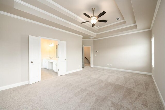 8245 Dawson View Way, Cumming, GA 30028 - unfurnished bedroom featuring light colored carpet, a tray ceiling, ornamental molding, baseboards, and connected bathroom