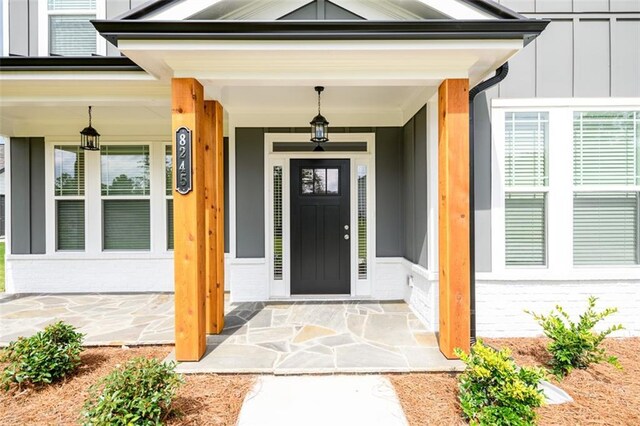 8245 Dawson View Way, Cumming, GA 30028 - property entrance featuring board and batten siding and brick siding