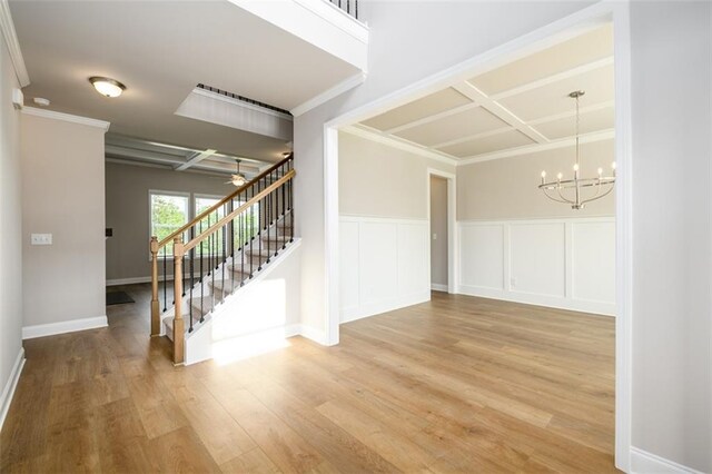 8245 Dawson View Way, Cumming, GA 30028 - stairway with coffered ceiling, a chandelier, wood finished floors, ornamental molding, and a ceiling fan