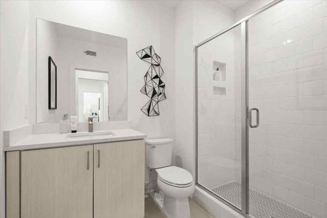 230 New St Unit 2201-4, Decatur, GA 30030 - bathroom featuring toilet, vanity, and a shower stall