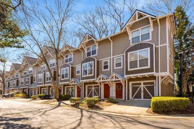 380 Grant Cir SE Unit 110, Atlanta, GA 30315 - townhome / multi-family property with driveway, an attached garage, and a residential view