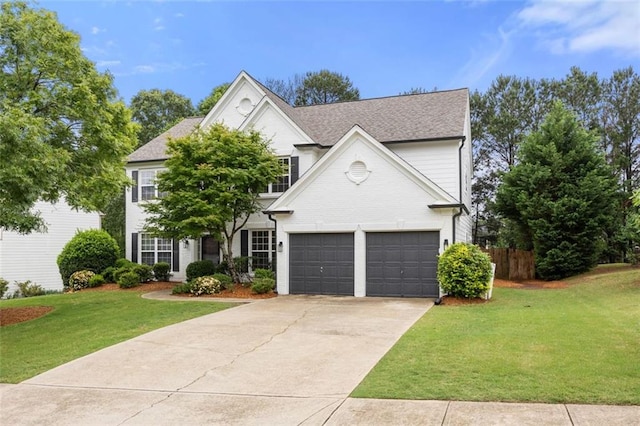 5156 Amberden Hall Dr, Suwanee, GA 30024 - traditional home with concrete driveway, an attached garage, and a shingled roof
