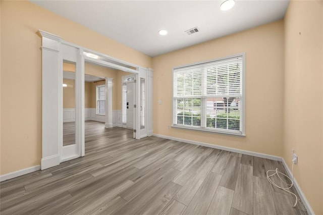 5156 Amberden Hall Dr, Suwanee, GA 30024 - spare room featuring wood finished floors, baseboards, recessed lighting, and ornate columns
