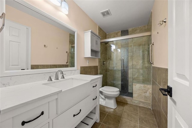 5156 Amberden Hall Dr, Suwanee, GA 30024 - full bath with vanity, a stall shower, toilet, and tile patterned floors