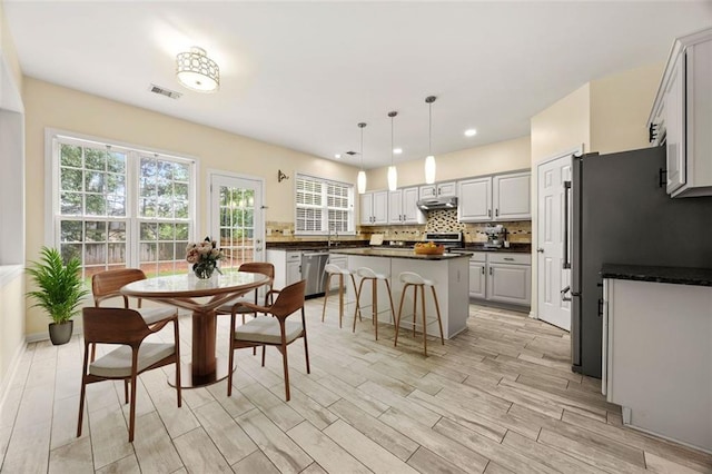 5156 Amberden Hall Dr, Suwanee, GA 30024 - dining room with light wood-style flooring and recessed lighting