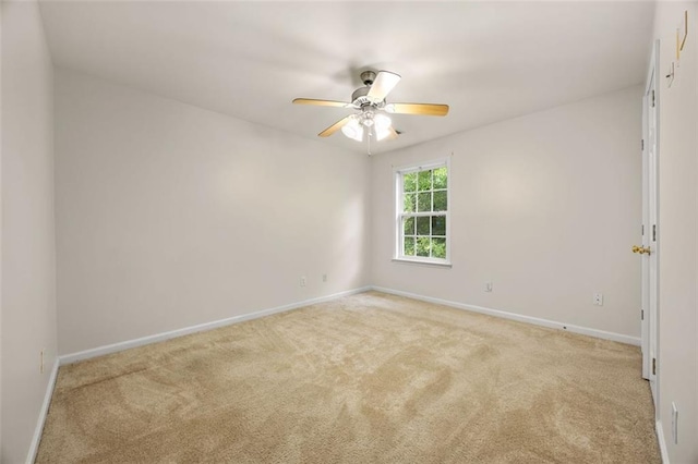 5156 Amberden Hall Dr, Suwanee, GA 30024 - spare room featuring light colored carpet, baseboards, and a ceiling fan