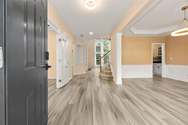 5156 Amberden Hall Dr, Suwanee, GA 30024 - foyer entrance featuring light wood-style flooring, wainscoting, stairway, decorative columns, and a decorative wall