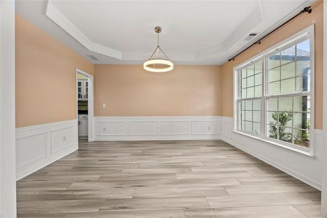 5156 Amberden Hall Dr, Suwanee, GA 30024 - unfurnished room with ornamental molding, a tray ceiling, light wood finished floors, and wainscoting