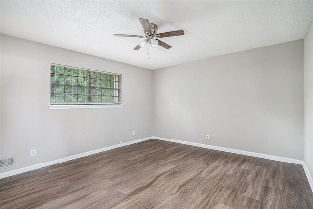 6354 Shannon Pkwy Unit 30C, Union City, GA 30291 - spare room featuring wood finished floors, a ceiling fan, baseboards, and a textured ceiling