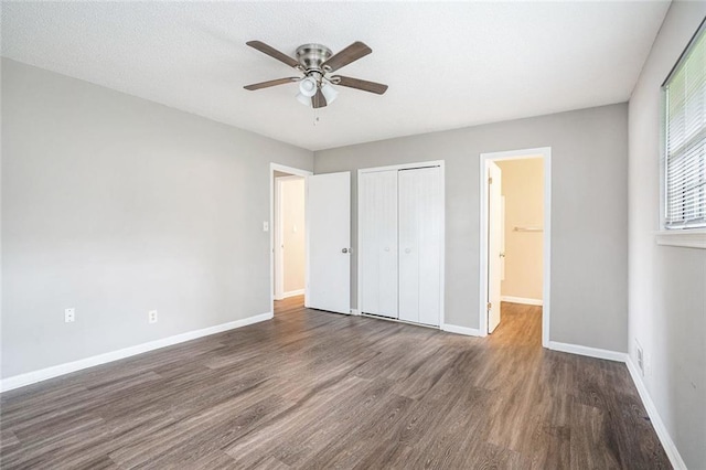 6354 Shannon Pkwy Unit 30C, Union City, GA 30291 - unfurnished bedroom with wood finished floors, a closet, baseboards, and a ceiling fan