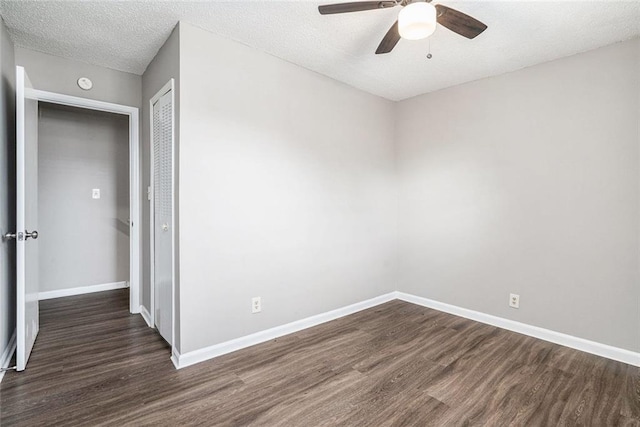 6354 Shannon Pkwy Unit 30C, Union City, GA 30291 - empty room with dark wood finished floors, ceiling fan, baseboards, and a textured ceiling