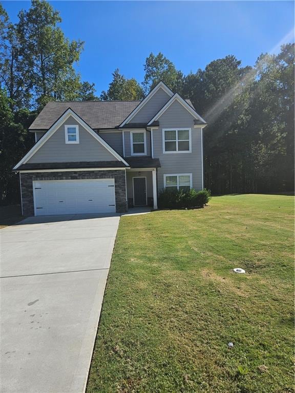 view of front facade with a front lawn and a garage