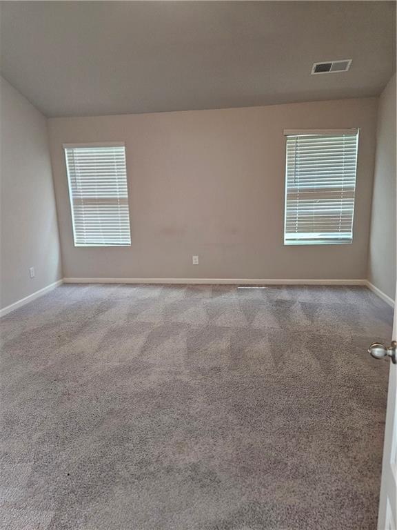 unfurnished living room featuring sink and dark hardwood / wood-style flooring