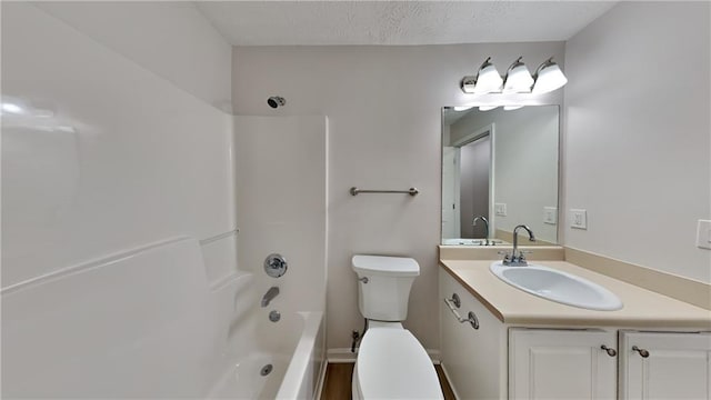 full bathroom featuring vanity, a textured ceiling, shower / bathtub combination, and toilet