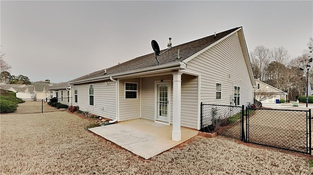 rear view of house with a patio