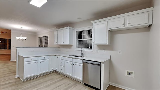 kitchen with white cabinetry, sink, decorative light fixtures, and dishwasher