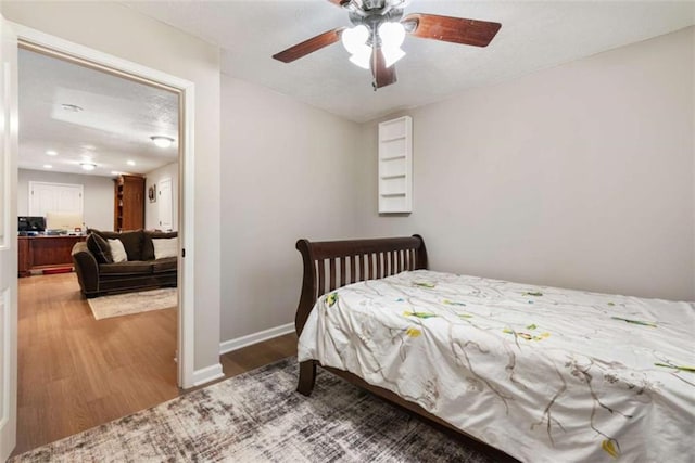 bedroom featuring ceiling fan and wood-type flooring