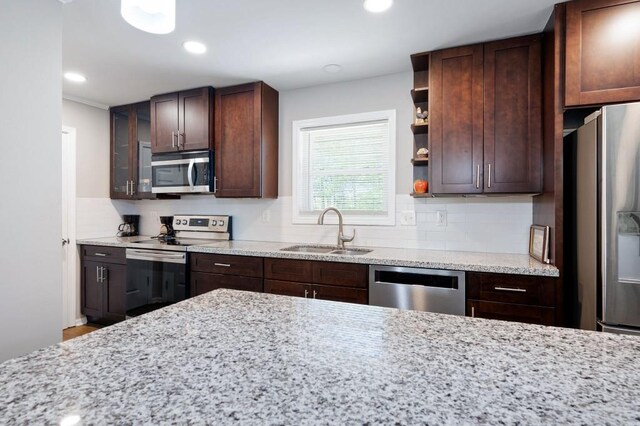 4284 Carlos Ct, Powder Springs, GA 30127 - kitchen featuring decorative backsplash, a sink, open shelves, and stainless steel appliances