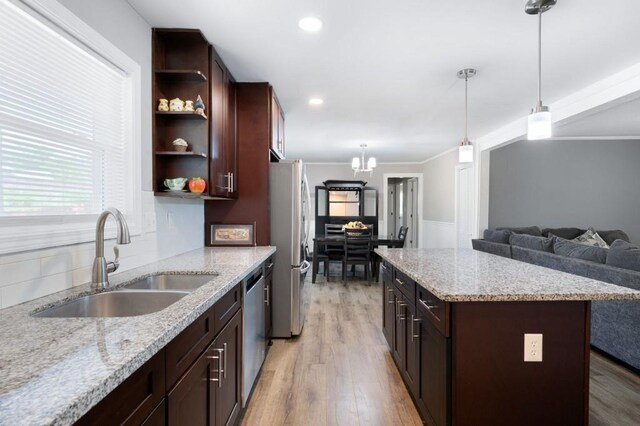 4284 Carlos Ct, Powder Springs, GA 30127 - kitchen featuring dark brown cabinetry, ornamental molding, open shelves, appliances with stainless steel finishes, and a sink