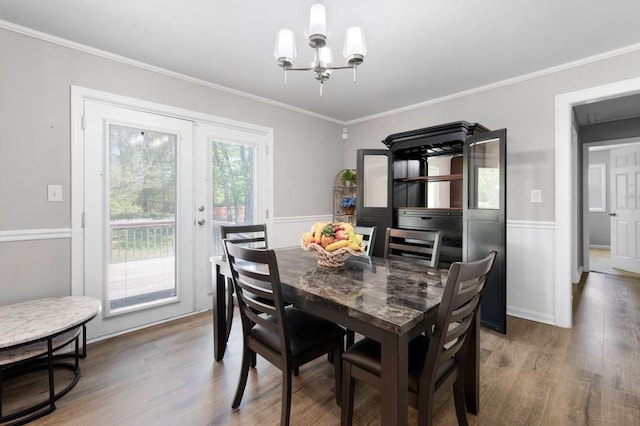 4284 Carlos Ct, Powder Springs, GA 30127 - dining area featuring crown molding, wainscoting, a chandelier, and wood finished floors