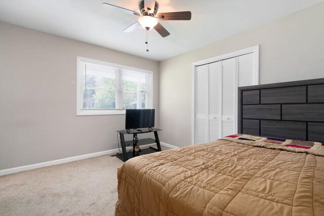 4284 Carlos Ct, Powder Springs, GA 30127 - carpeted bedroom featuring a closet, baseboards, and a ceiling fan