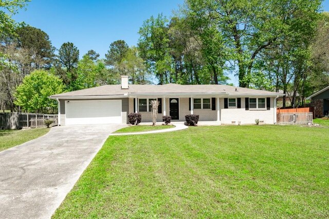 4284 Carlos Ct, Powder Springs, GA 30127 - ranch-style house featuring driveway, fence, a garage, and a front lawn