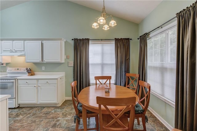 965 Under Ct, Sugar Hill, GA 30518 - dining space featuring vaulted ceiling, a chandelier, stone finish floors, and baseboards