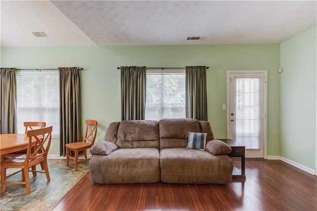 965 Under Ct, Sugar Hill, GA 30518 - living area with wood finished floors, plenty of natural light, and baseboards