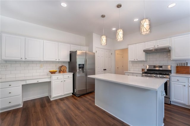 kitchen featuring stainless steel appliances, decorative backsplash, light countertops, white cabinets, and recessed lighting