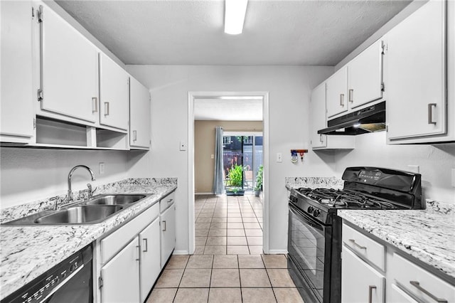 kitchen featuring light tile patterned floors, sink, white cabinetry, and black appliances