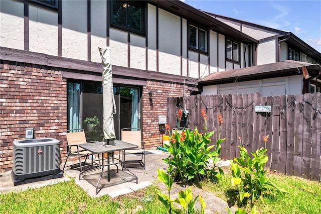 back of house featuring a patio and central AC