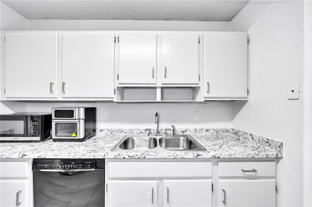 kitchen featuring dishwasher, white cabinets, and sink