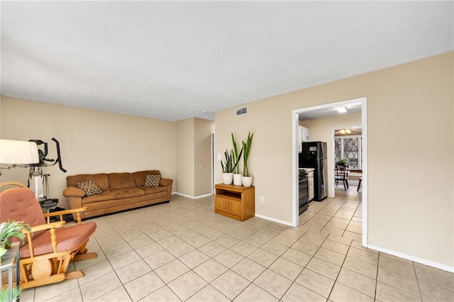 living room with light tile patterned flooring