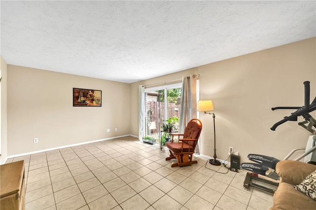 sitting room featuring light tile patterned floors and a textured ceiling