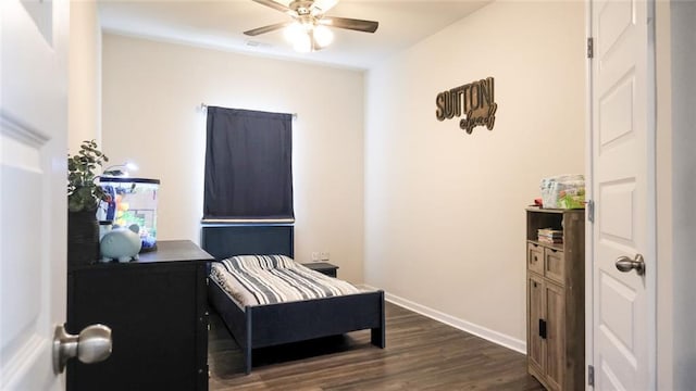 bedroom featuring baseboards, dark wood-style floors, and ceiling fan