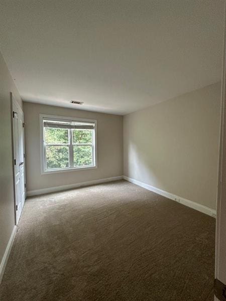 empty room featuring carpet flooring