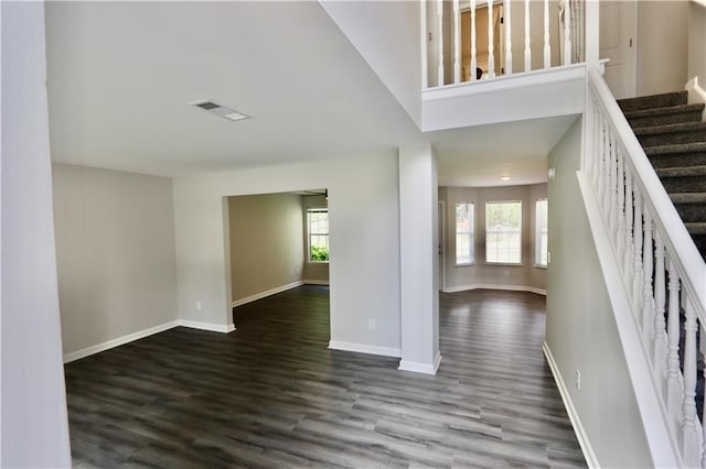 843 Kendall Park Dr, Winder, GA 30680 - foyer entrance with dark wood finished floors and stairs