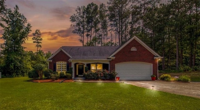 ranch-style home with concrete driveway, brick siding, a lawn, and an attached garage