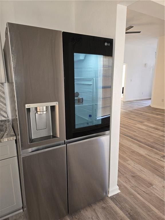 details with gray cabinets, ceiling fan, and light hardwood / wood-style floors