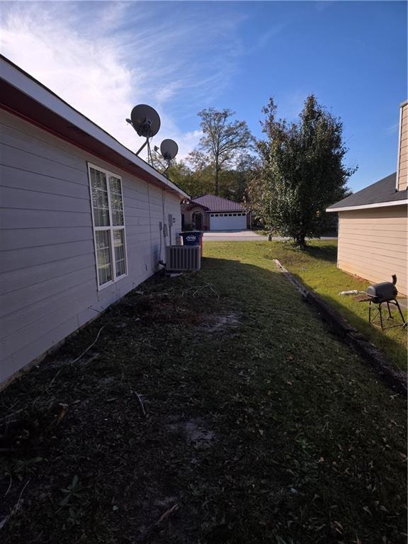 view of yard featuring central AC