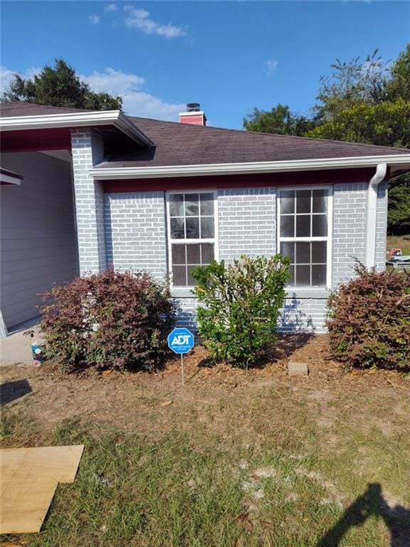 view of home's exterior featuring a lawn