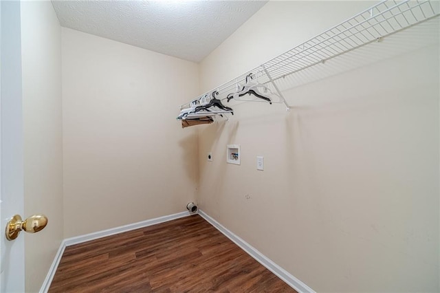 laundry area with electric dryer hookup, washer hookup, dark wood-style flooring, and baseboards