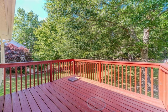 deck featuring a lawn