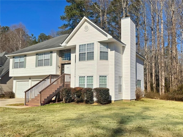 raised ranch with a front lawn and a garage