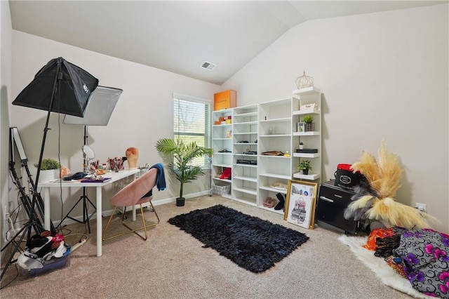 carpeted home office with lofted ceiling, visible vents, and baseboards