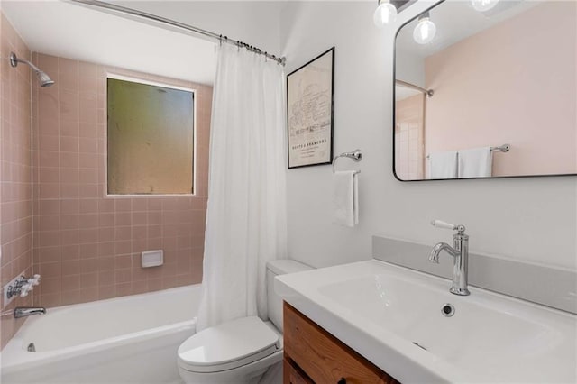 bathroom with toilet, shower / bathtub combination with curtain, and vanity