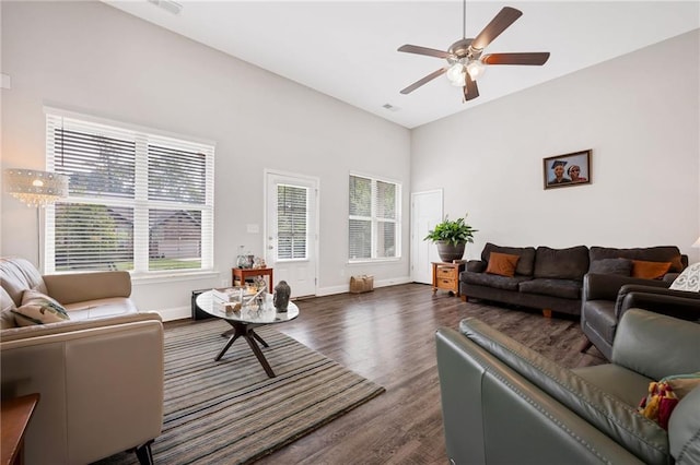 living area with dark wood-style floors, visible vents, baseboards, and a ceiling fan