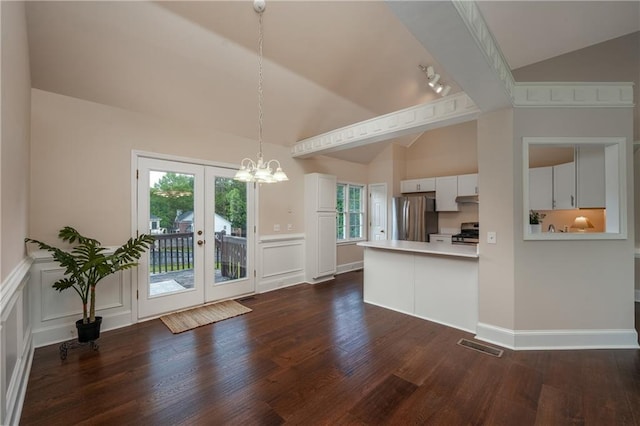 102 Peaceful Vw, Acworth, GA 30102 - kitchen with appliances with stainless steel finishes, a chandelier, dark wood finished floors, white cabinetry, and a decorative wall