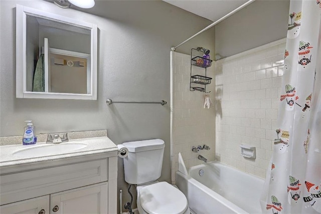 full bathroom with shower / bathtub combination with curtain, vanity, and toilet